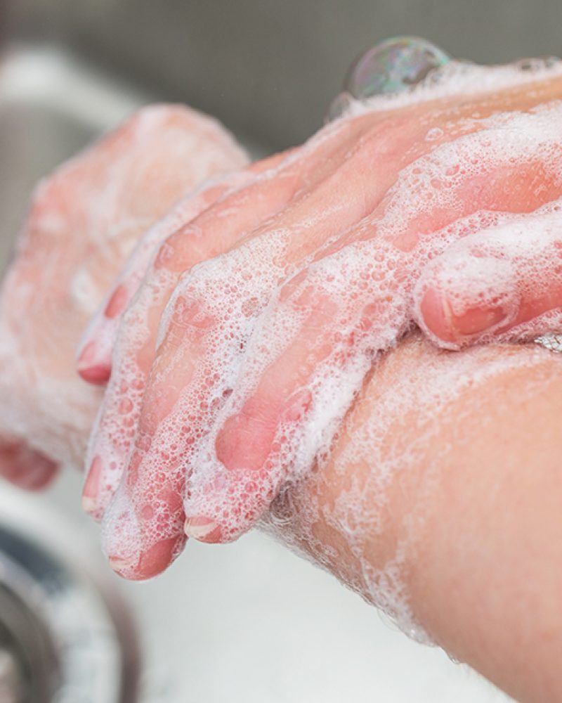 woman wash her hands with soap, cleaning concept image. ideal for websites and magazines layouts